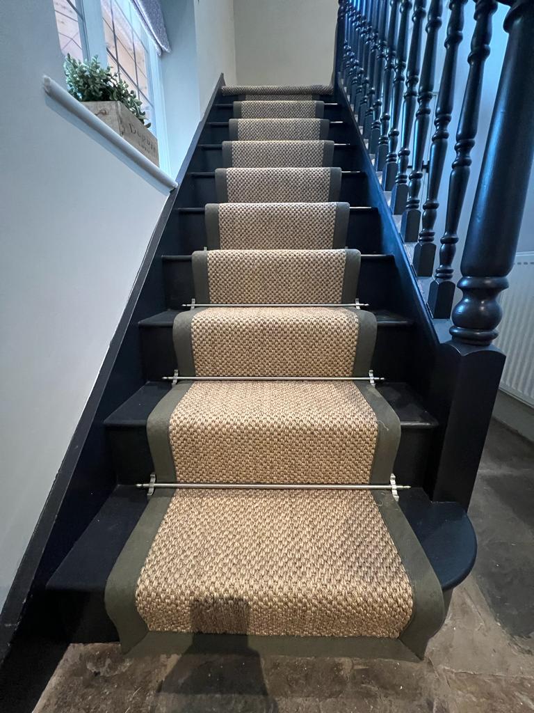 A bespoke stair runner made from 100% sisal Malay Chen from Altermative with cotton border and nickel stair rods, supplied and installed by Flooring 4 You Ltd at this home in Cranage Cheshire